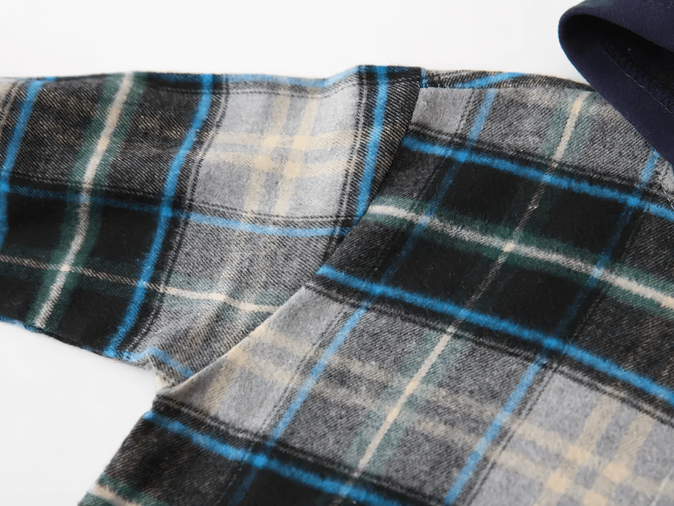 Close-up of the Plaid Hooded Long Sleeved Shirt for Boys and Girls - SF3524 featuring blue and green checkered flannel fabric.